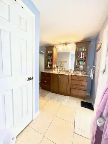 a large bathroom with a tub and shower