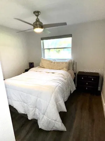 a bathroom with a sink a toilet and a window