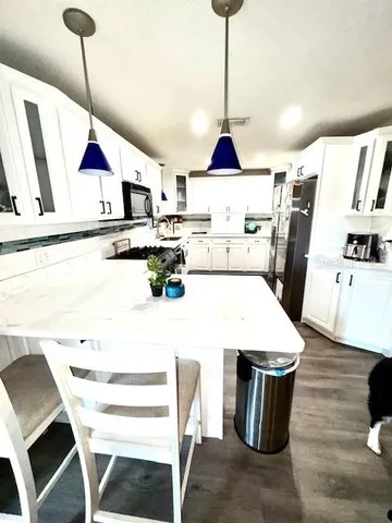 a very nice looking dining room with a table and chairs