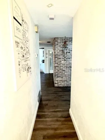 a view of balcony with wooden floor