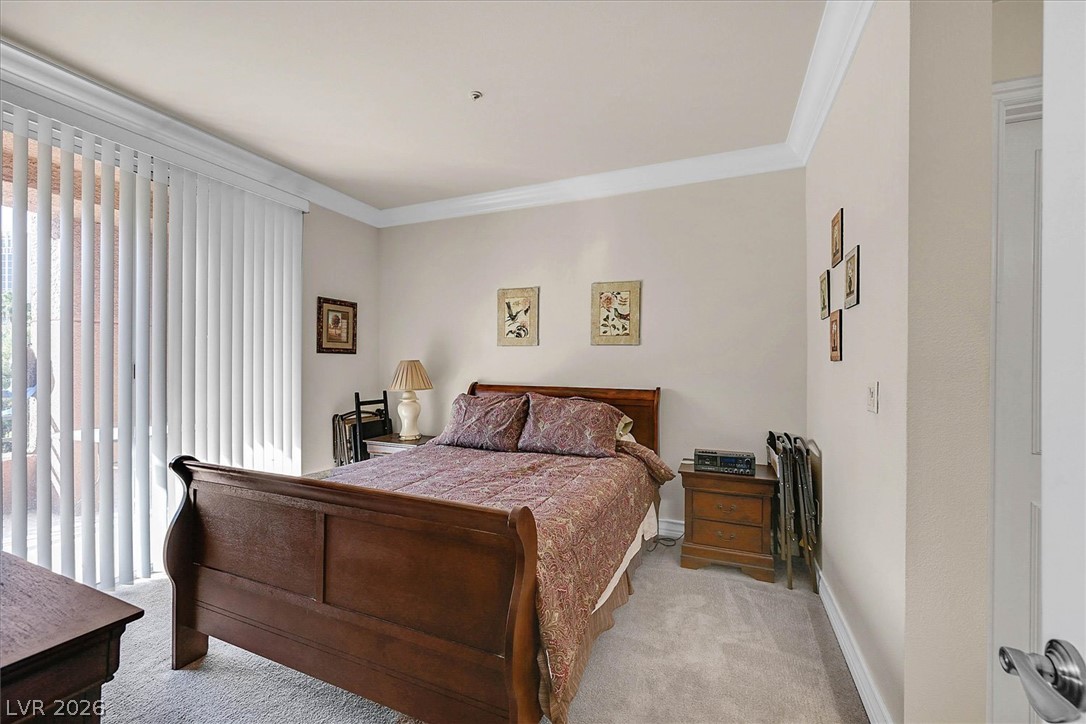 220 East Flamingo Road, Unit 305 Las Vegas, NV 89169 - Photo 9 of 26 A restful chamber showcasing ample floor space and inviting crown molding.