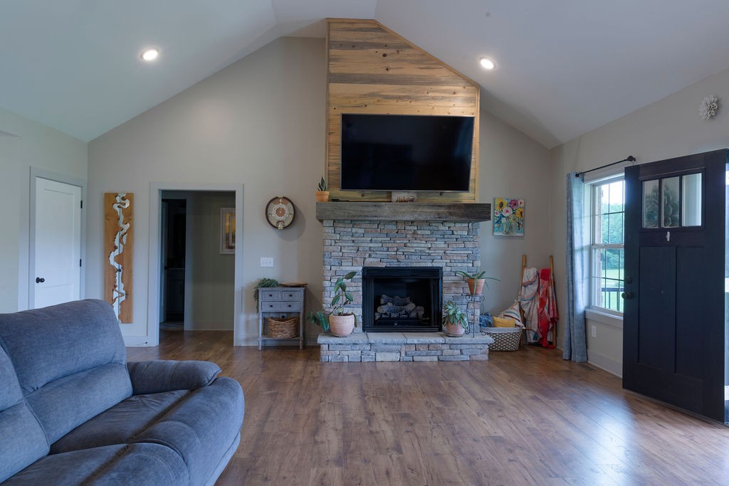 1701 Rock Bridge Road Bethpage, TN 37022 - Photo 8 of 29 a living room with furniture a flat screen tv and a fireplace