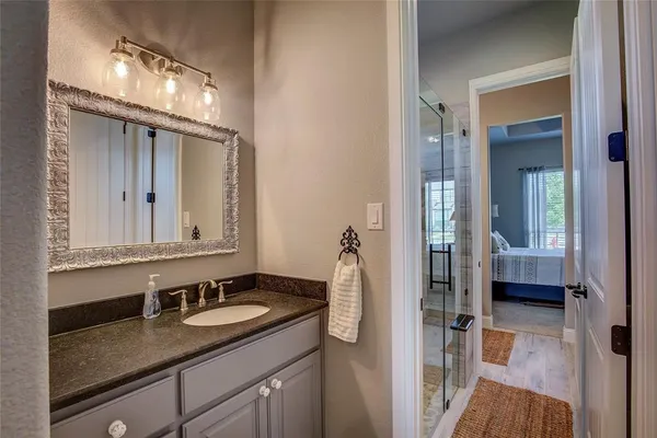 a bathroom with a sink and a mirror