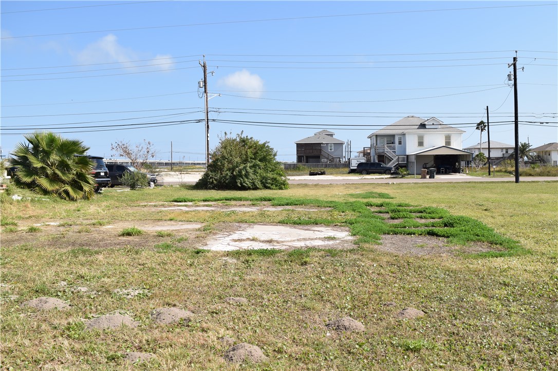 1214 Laguna Shores Road Corpus Christi, TX 78418 - Photo 1 of 7 a view of a house with a big yard