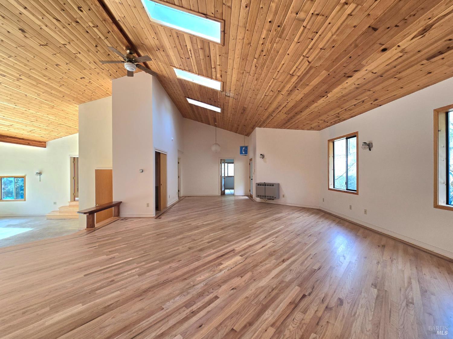 36955 Eureka Stagecoach Road Willits, CA 95490 - Photo 9 of 46 a view of an empty room with wooden floor and a window