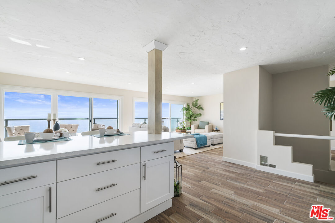 18147 Coastline Drive, Unit 6 Malibu, CA 90265 - Photo 7 of 26 a open kitchen with sink and cabinets
