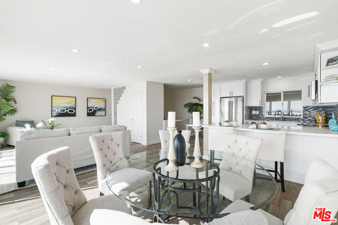 18147 Coastline Drive, Unit 6 Malibu, CA 90265 - Photo 10 of 26 a living room with furniture and kitchen view