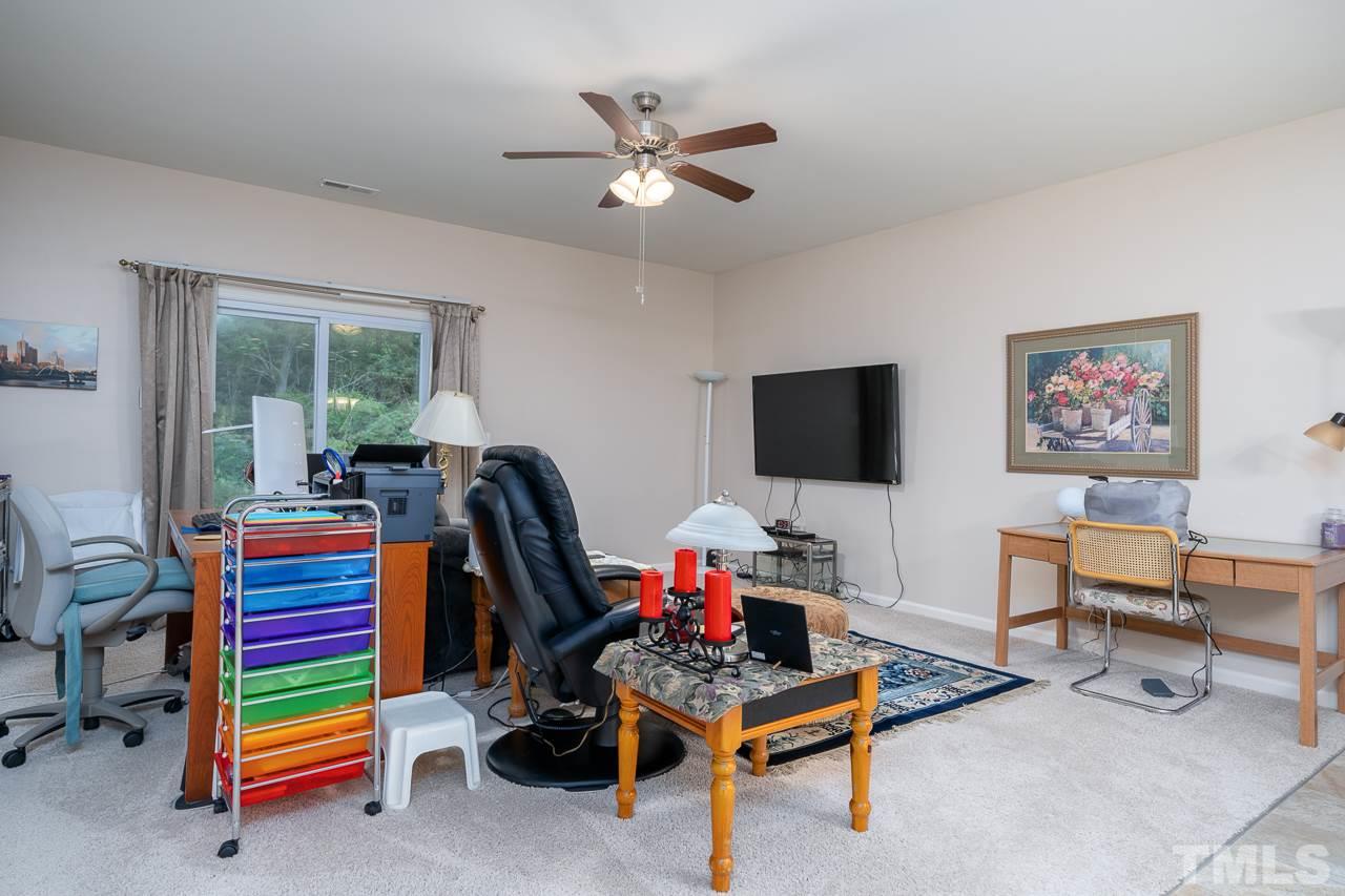 3609 Waleback Lane Raleigh, NC 27610 - Photo 11 of 18 a living room with furniture and a flat screen tv