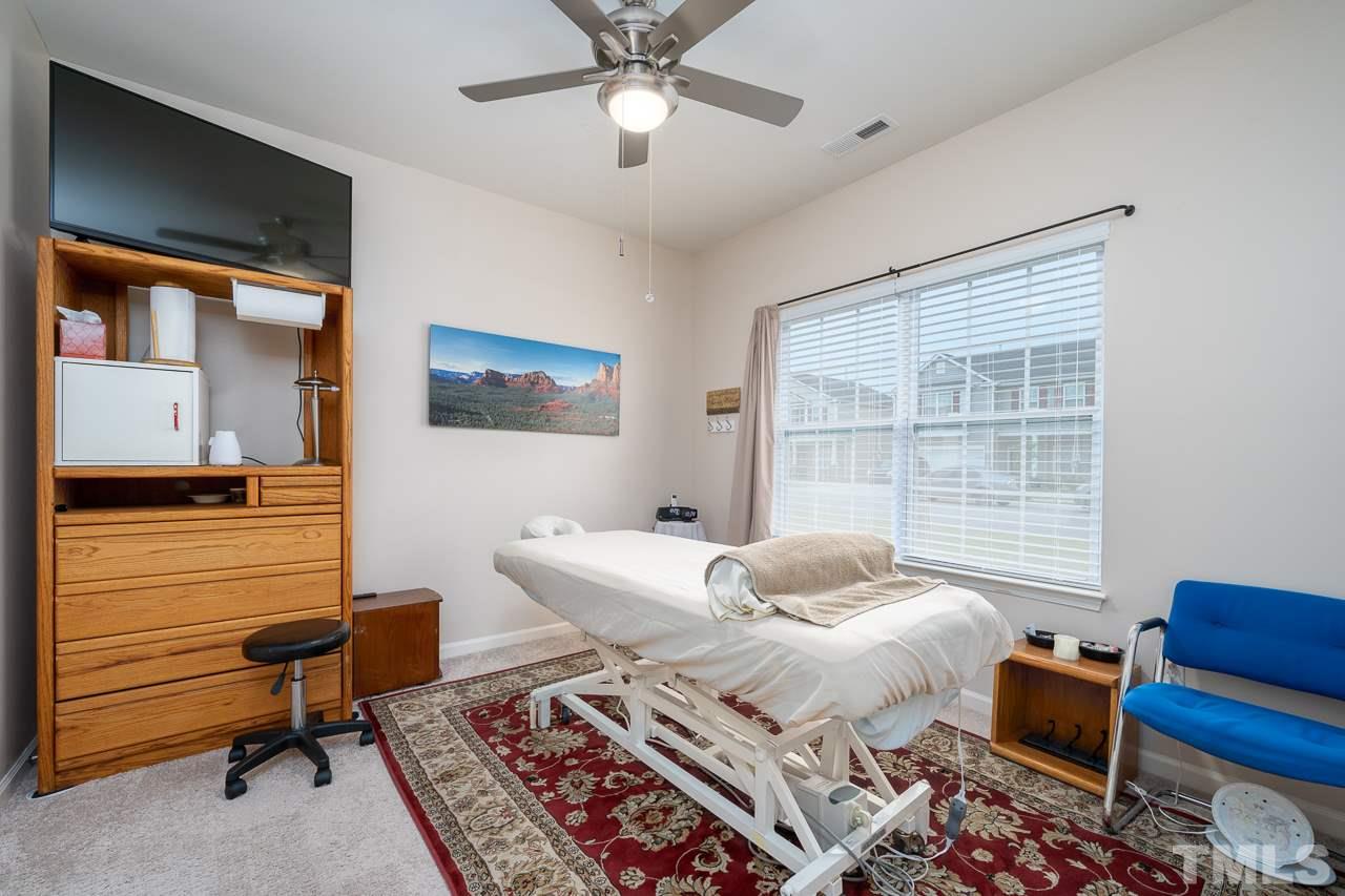 3609 Waleback Lane Raleigh, NC 27610 - Photo 12 of 18 a bedroom with a bed and wooden floor