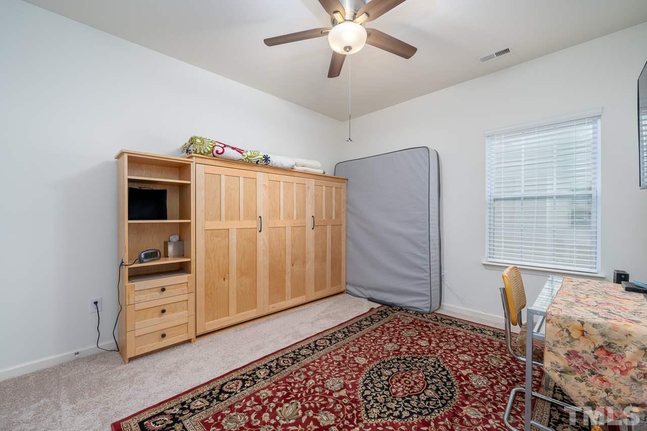 3609 Waleback Lane Raleigh, NC 27610 - Photo 13 of 18 a view of a bedroom with furniture and wooden floor