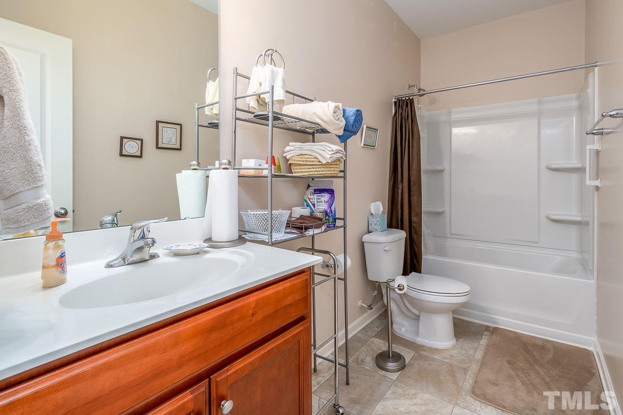 3609 Waleback Lane Raleigh, NC 27610 - Photo 14 of 18 a bathroom with a sink a toilet and shower
