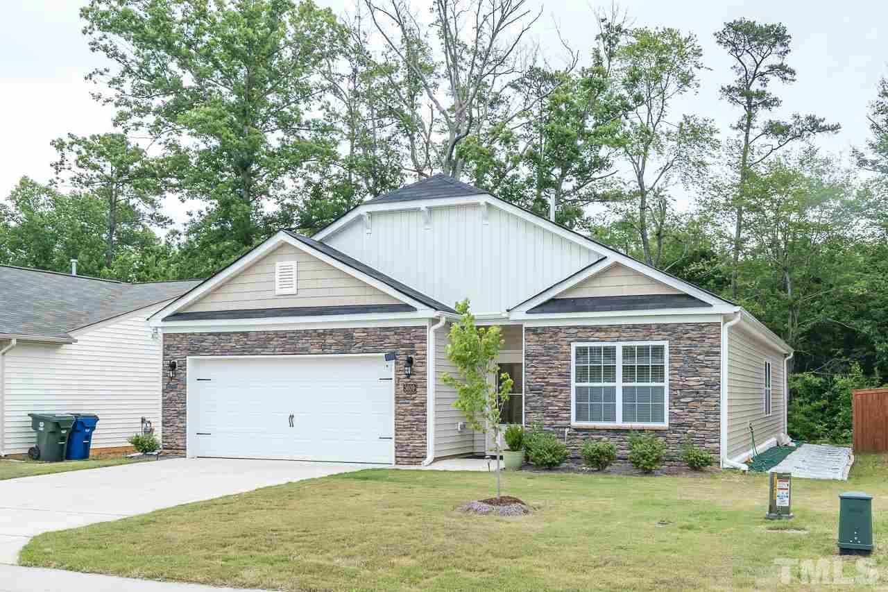 3609 Waleback Lane Raleigh, NC 27610 - Photo 18 of 18 a house with a yard in front of it