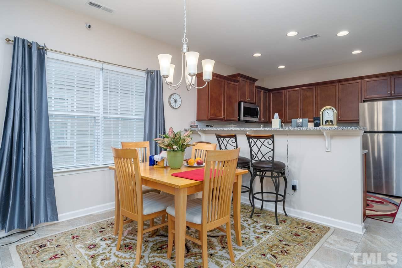3609 Waleback Lane Raleigh, NC 27610 - Photo 6 of 18 a view of a dining room with furniture and wooden floor