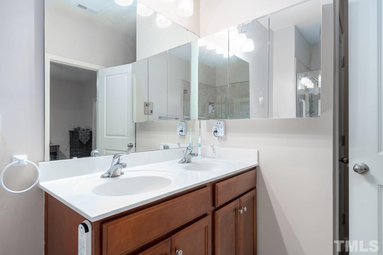 3609 Waleback Lane Raleigh, NC 27610 - Photo 9 of 18 a bathroom with a sink and a mirror