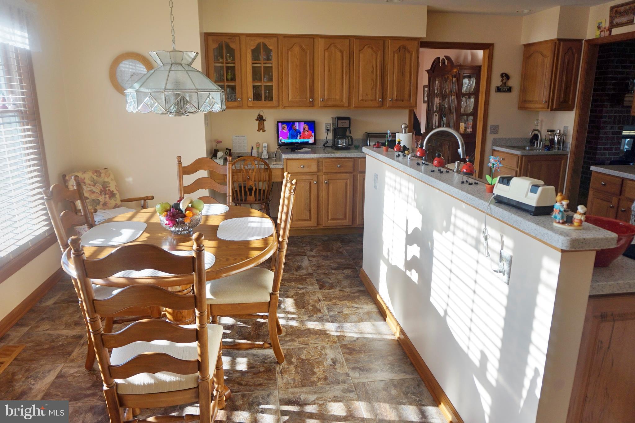 2395 McDowell Road Bridgeville, DE 19933 - Photo 29 of 76 Eat-in kitchen. Built-in desk space at the end.