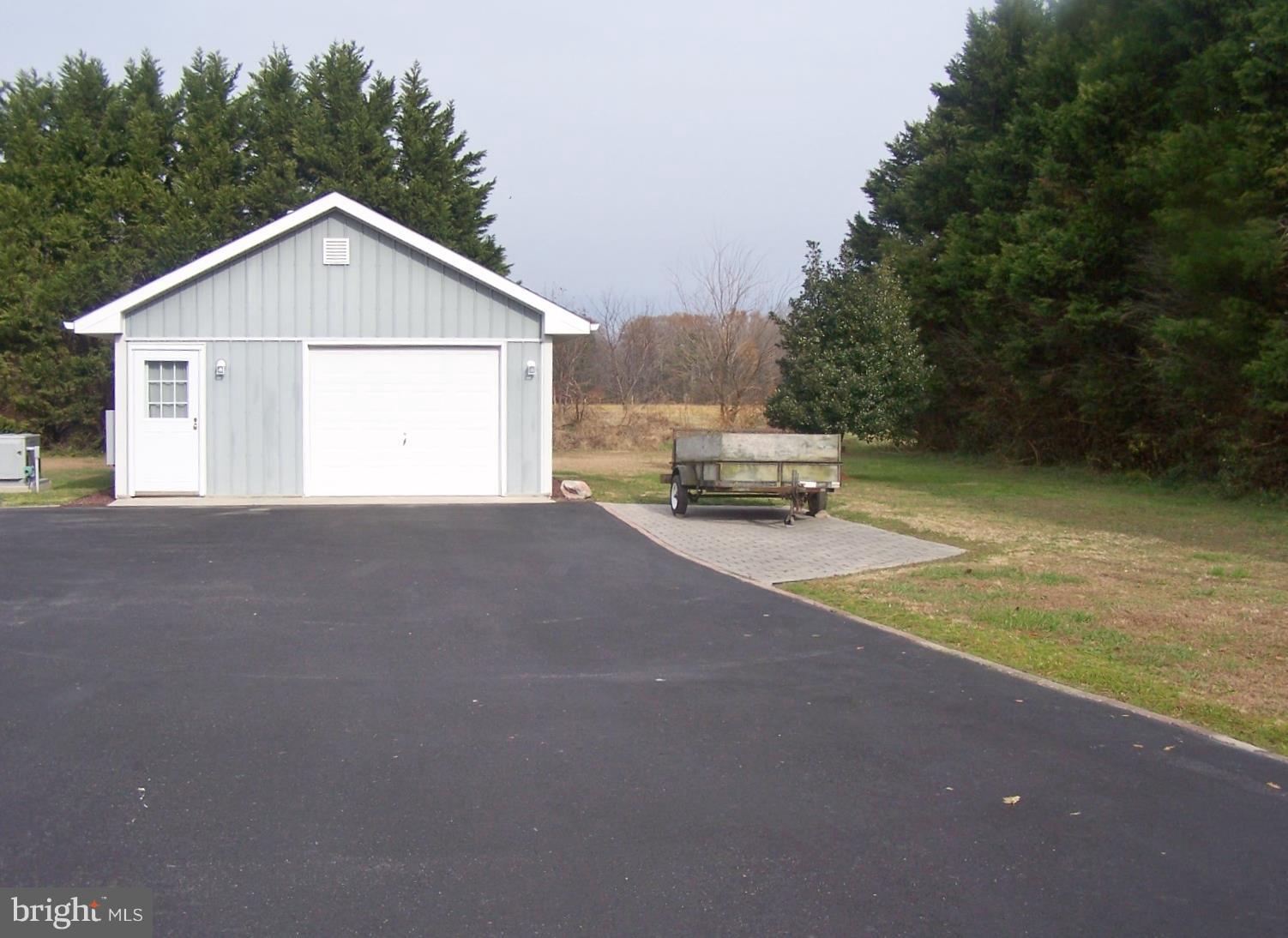 2395 McDowell Road Bridgeville, DE 19933 - Photo 64 of 76 More land beyond and Leyland Cypress for privacy.