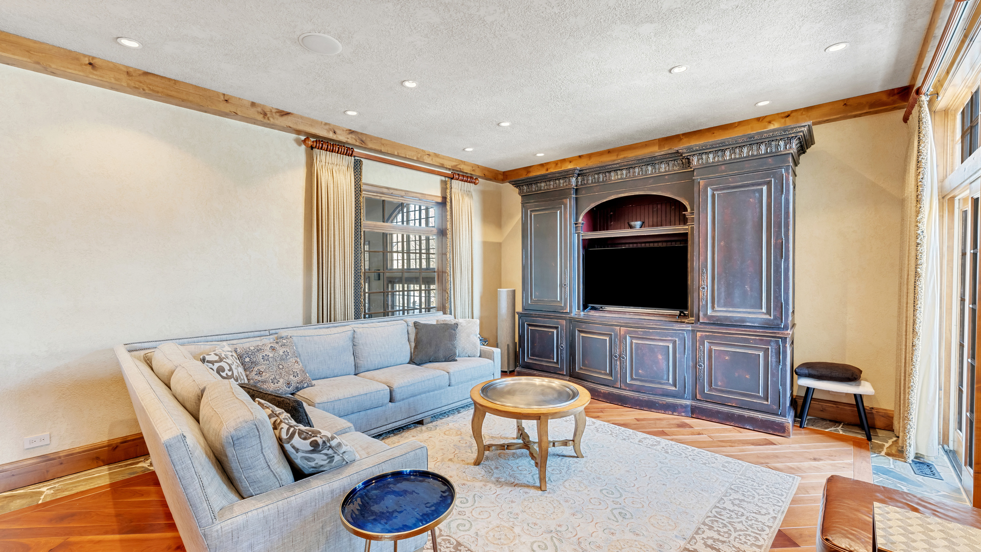 137 Singletree Road Orland Park, IL 60467 - Photo 29 of 75 a living room with furniture and a flat screen tv