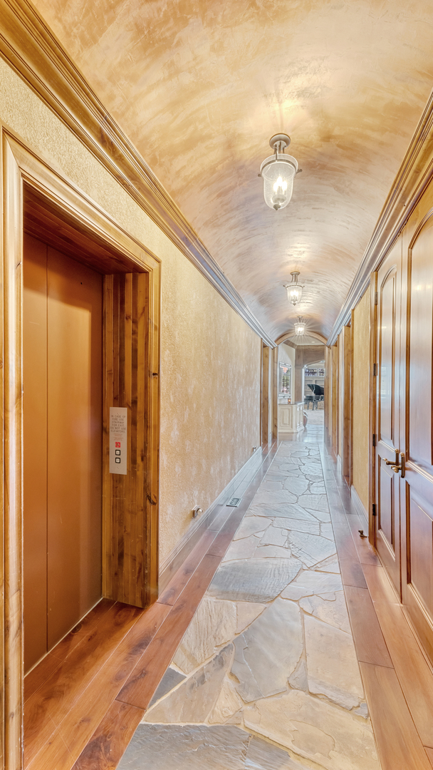 137 Singletree Road Orland Park, IL 60467 - Photo 48 of 75 a view of a hallway with wooden floor