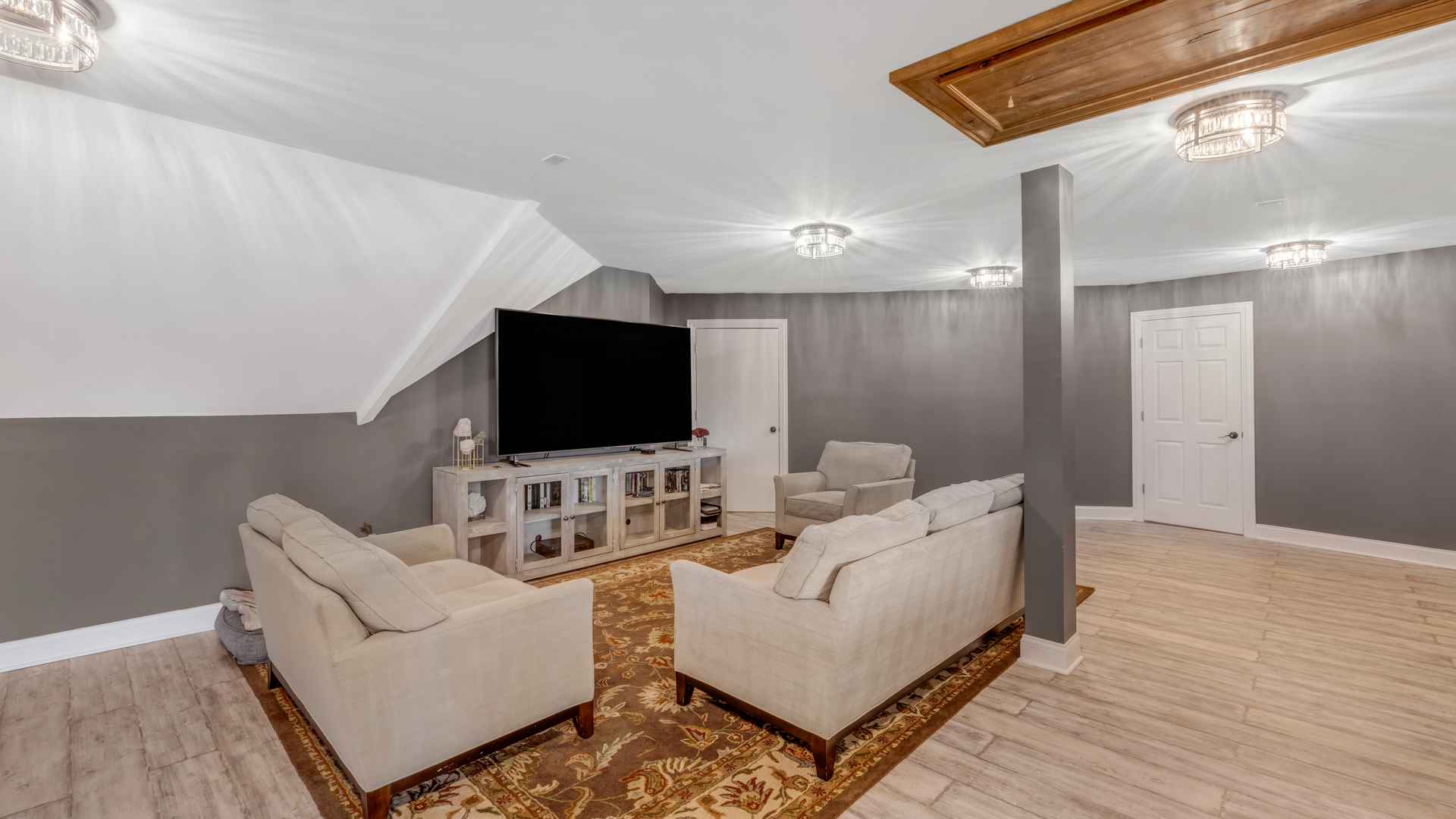 137 Singletree Road Orland Park, IL 60467 - Photo 56 of 75 a living room with furniture and a flat screen tv