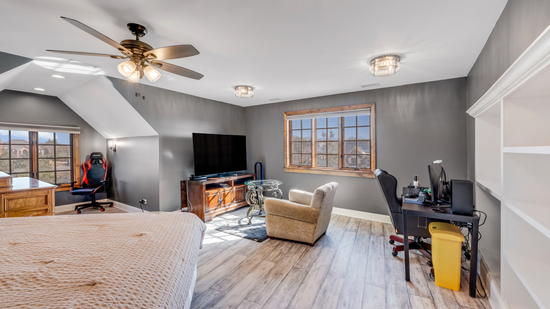 137 Singletree Road Orland Park, IL 60467 - Photo 57 of 75 a bedroom with furniture a bed and a flat screen tv