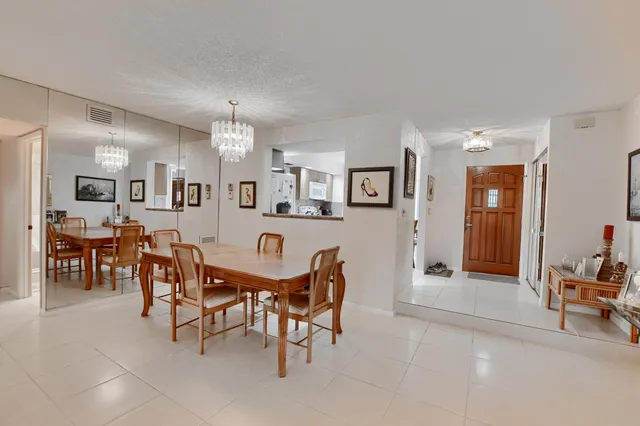 a kitchen with cabinets and white appliances