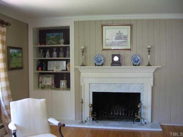 1408 Regent Place Raleigh, NC 27608 - Photo 3 of 12 a living room with furniture and a fireplace