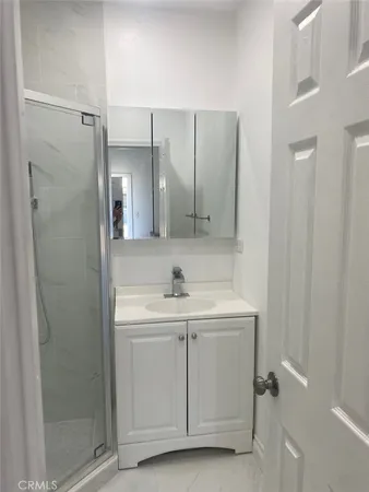a bathroom with a sink and mirror