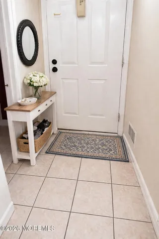 a view of a bathroom with a sink and a mirror