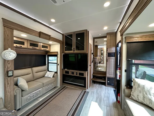a living room with furniture and a rug