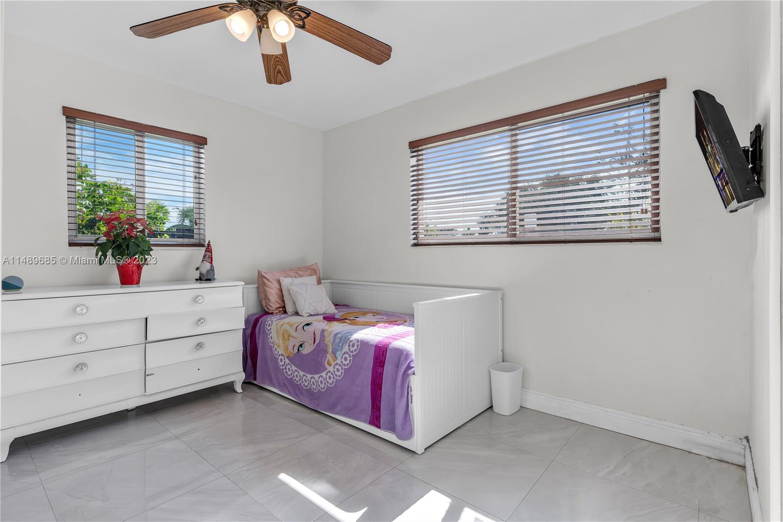 9511 Holiday Road Cutler Bay, FL 33157 - Photo 14 of 19 a bed room with a bed and a dresser