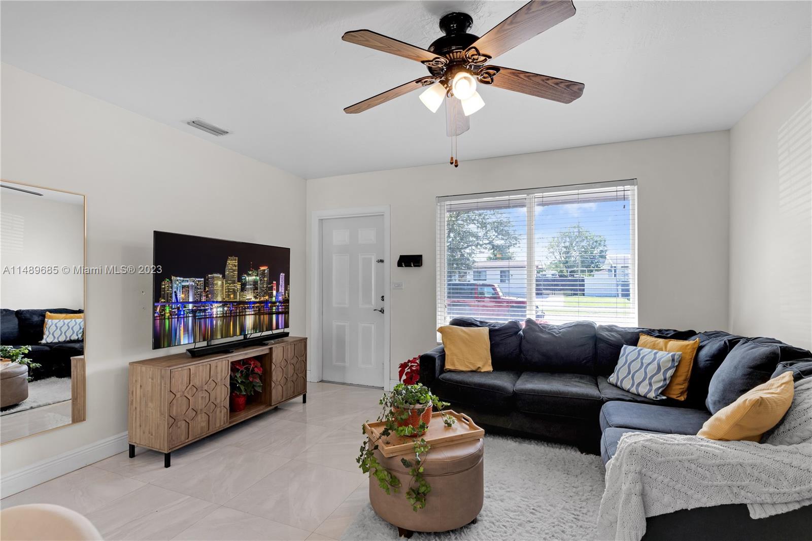 9511 Holiday Road Cutler Bay, FL 33157 - Photo 5 of 19 a living room with furniture and a flat screen tv