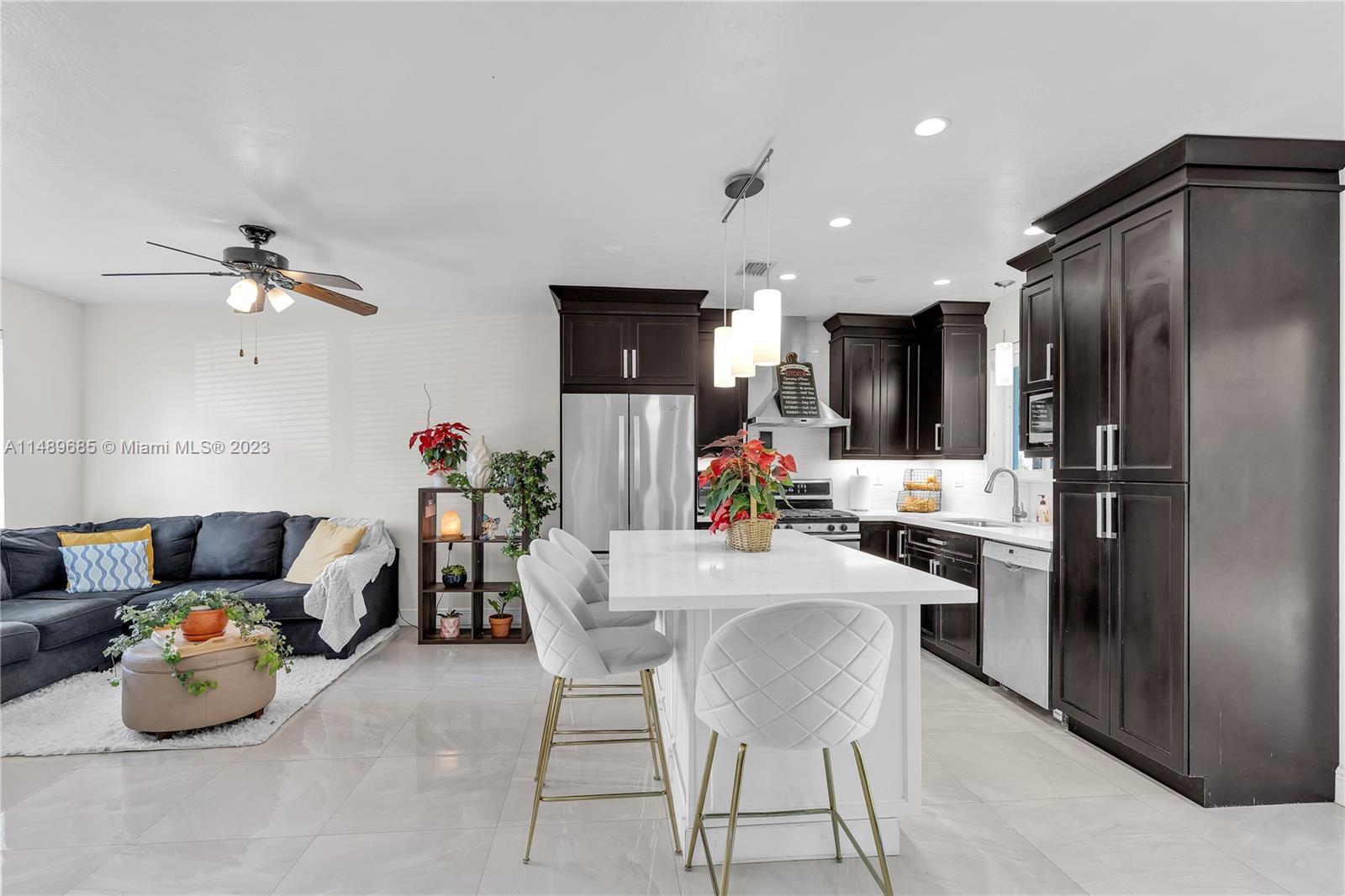 9511 Holiday Road Cutler Bay, FL 33157 - Photo 7 of 19 a kitchen with a refrigerator and microwave