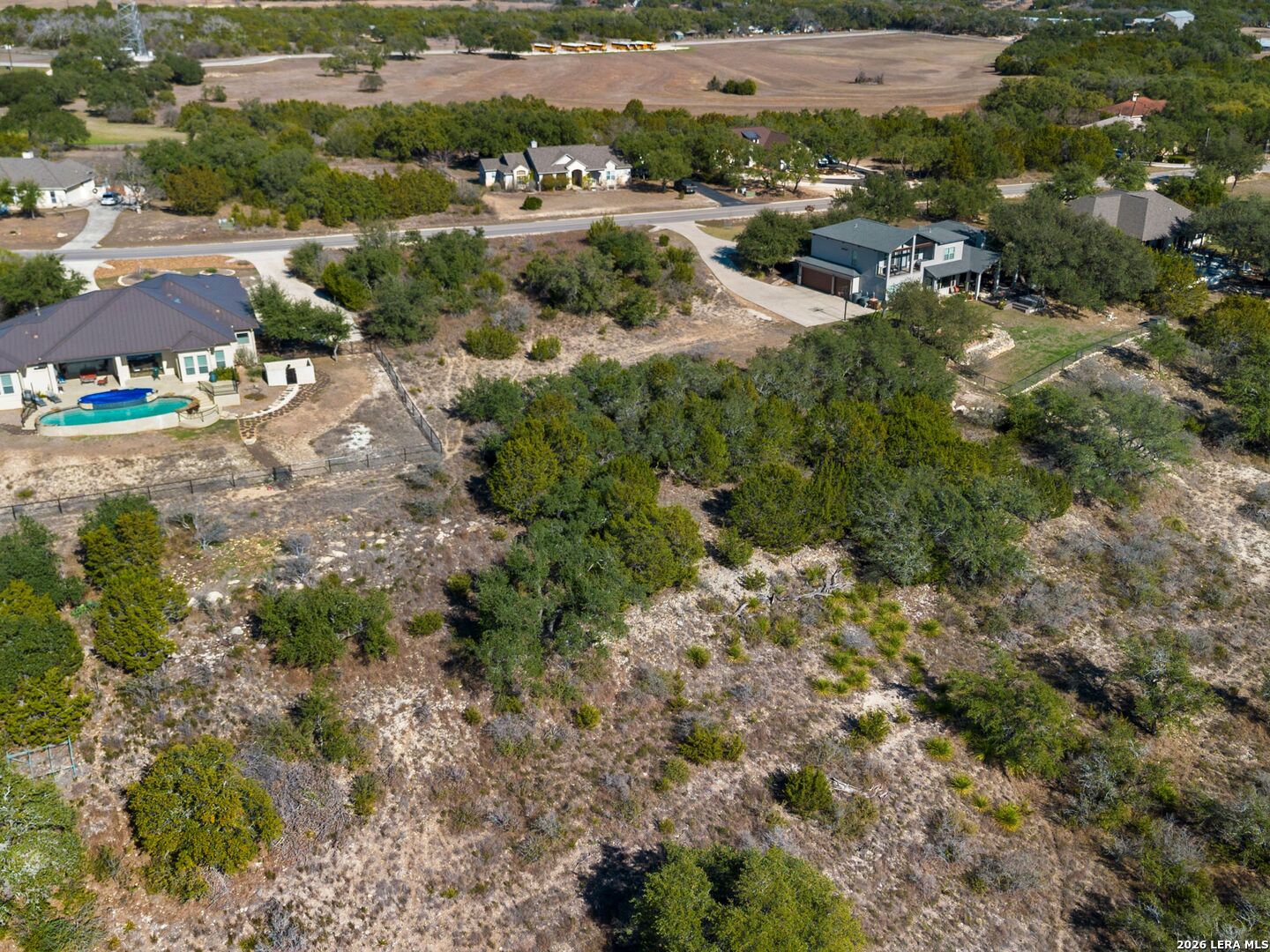 344 Quest Spring Branch, TX 78070 - Photo 9 of 16 an aerial view of residential houses with outdoor space and trees