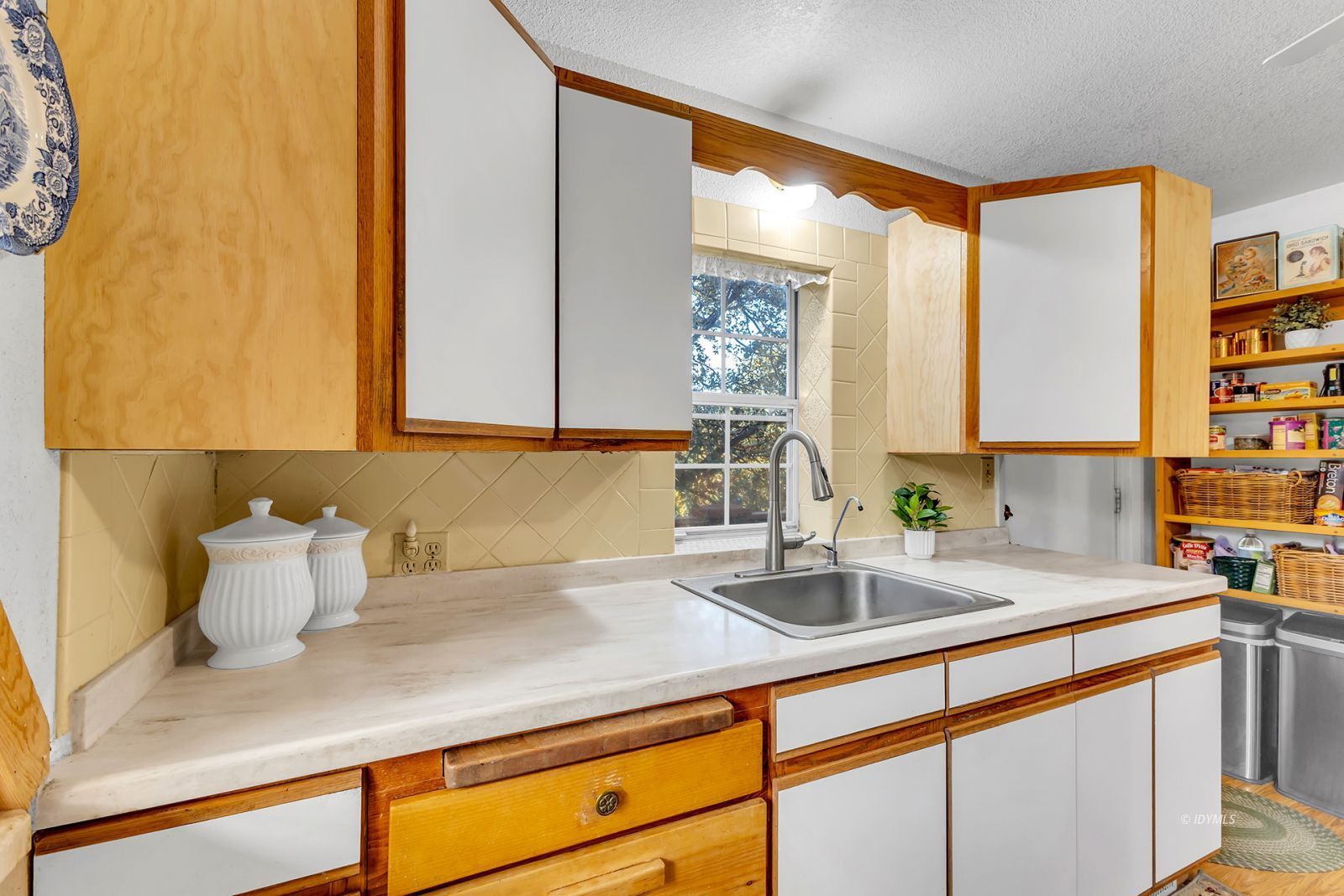26750 Saunders Meadow Road Idyllwild, CA 92549 - Photo 13 of 56 a kitchen with a sink and a window