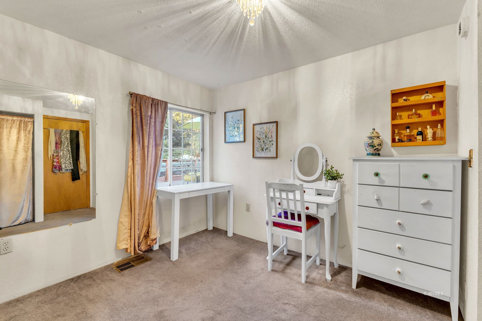 26750 Saunders Meadow Road Idyllwild, CA 92549 - Photo 22 of 56 a bedroom with a baby bed and a window