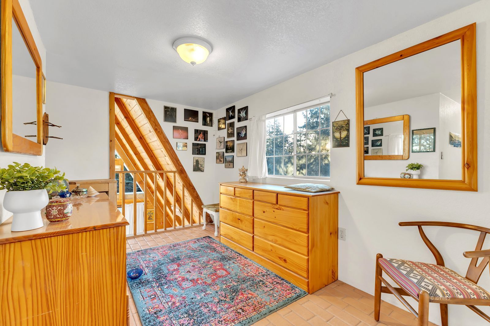 26750 Saunders Meadow Road Idyllwild, CA 92549 - Photo 27 of 56 a view of an entryway with wooden floor and windows