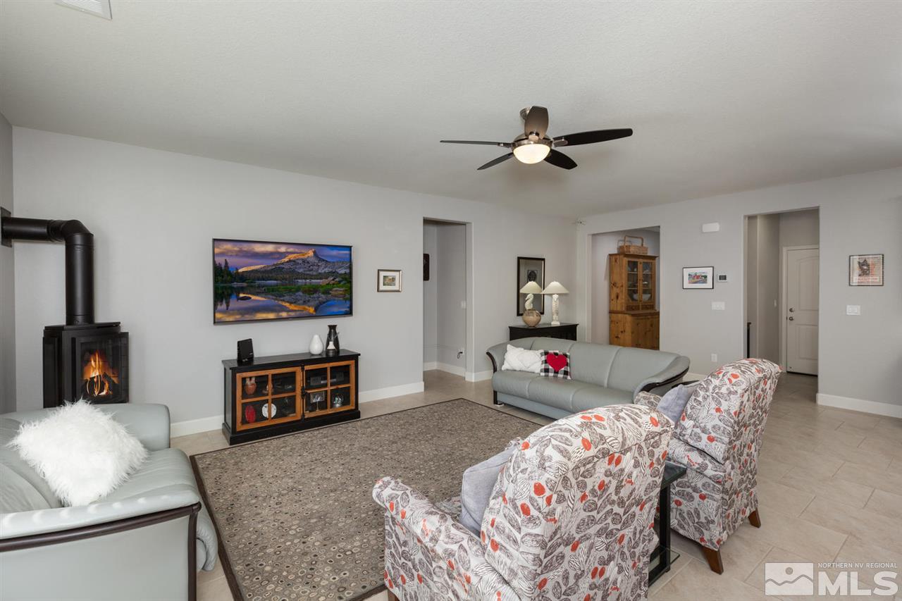 1830 Cascade Stable Lane Reno, NV 89521 - Photo 11 of 25 a bedroom with furniture and a flat screen tv