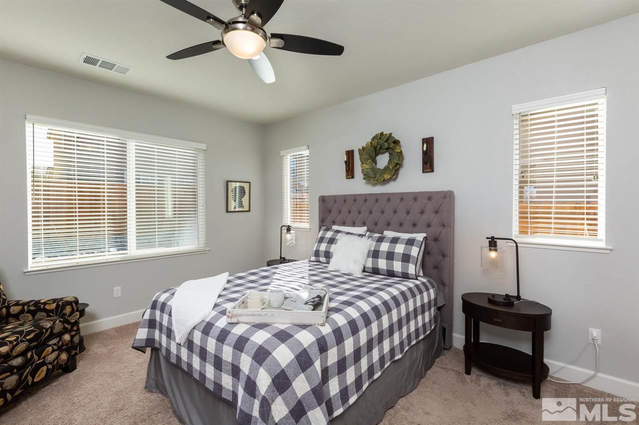 1830 Cascade Stable Lane Reno, NV 89521 - Photo 12 of 25 a bedroom with a bed and window