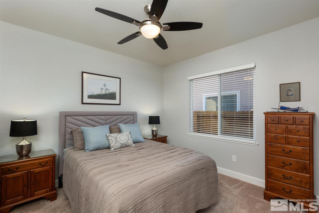 1830 Cascade Stable Lane Reno, NV 89521 - Photo 16 of 25 a bedroom with a bed and a dresser