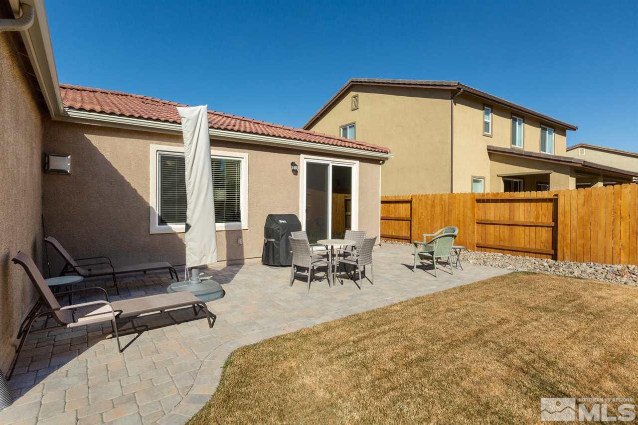 1830 Cascade Stable Lane Reno, NV 89521 - Photo 21 of 25 a backyard of a house with table and chairs
