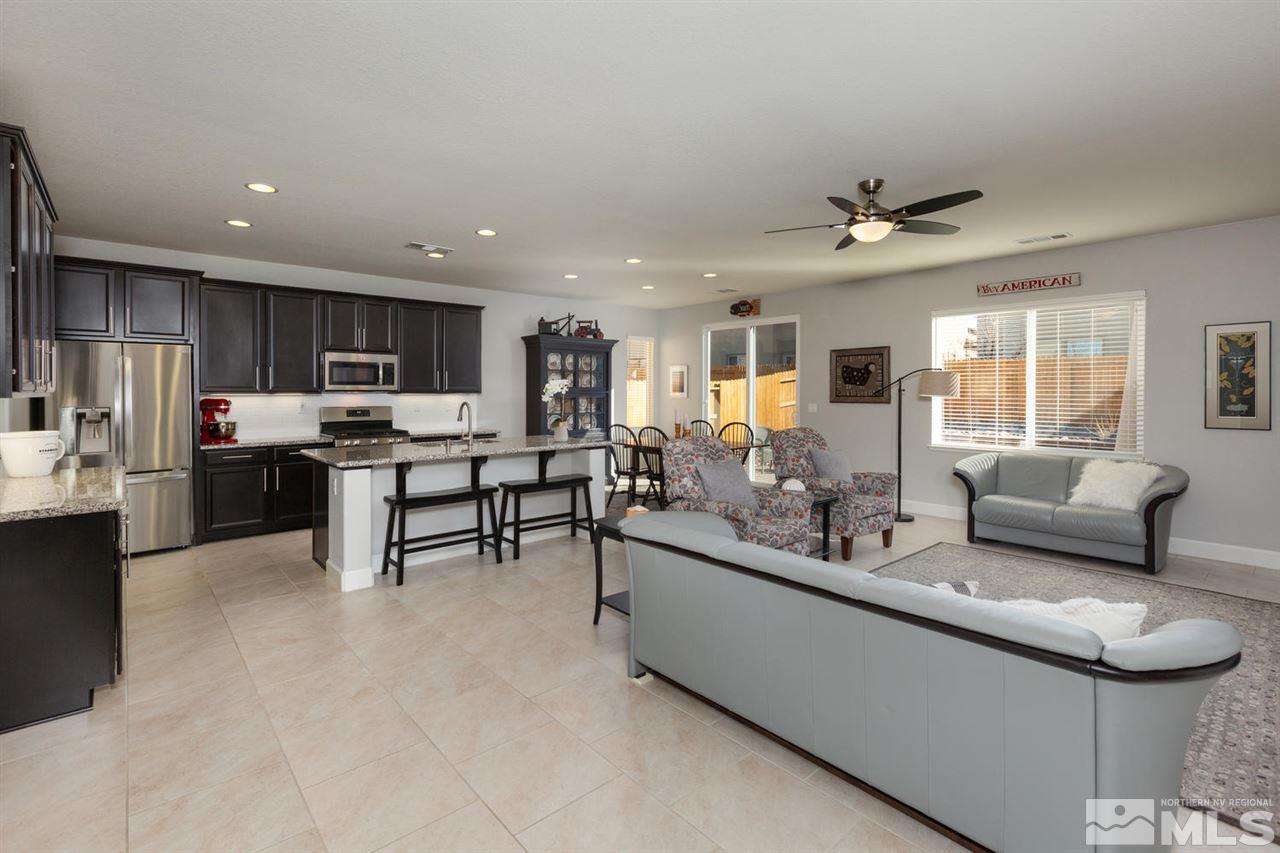 1830 Cascade Stable Lane Reno, NV 89521 - Photo 3 of 25 a living room with stainless steel appliances lots of counter space dining table furniture and a kitchen view