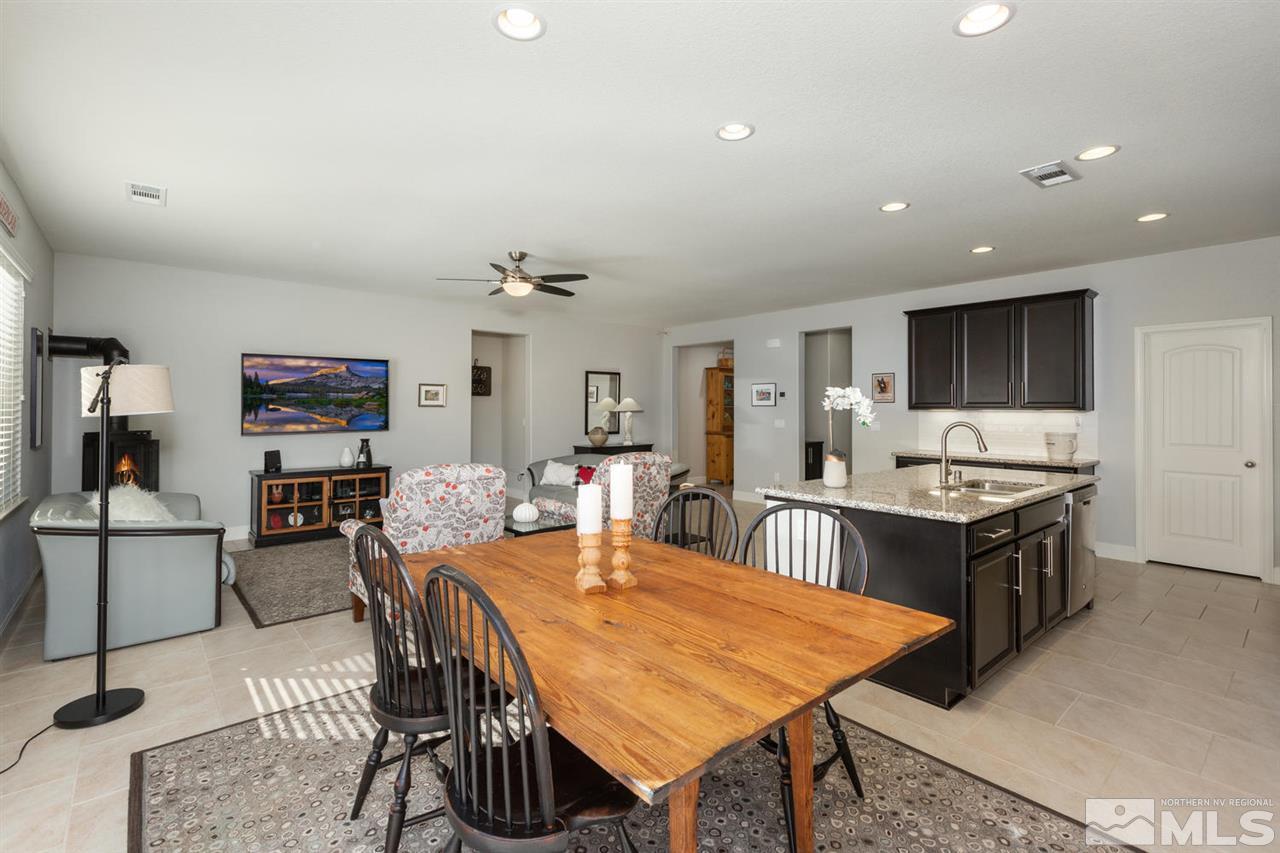 1830 Cascade Stable Lane Reno, NV 89521 - Photo 8 of 25 a large kitchen with a table and chairs