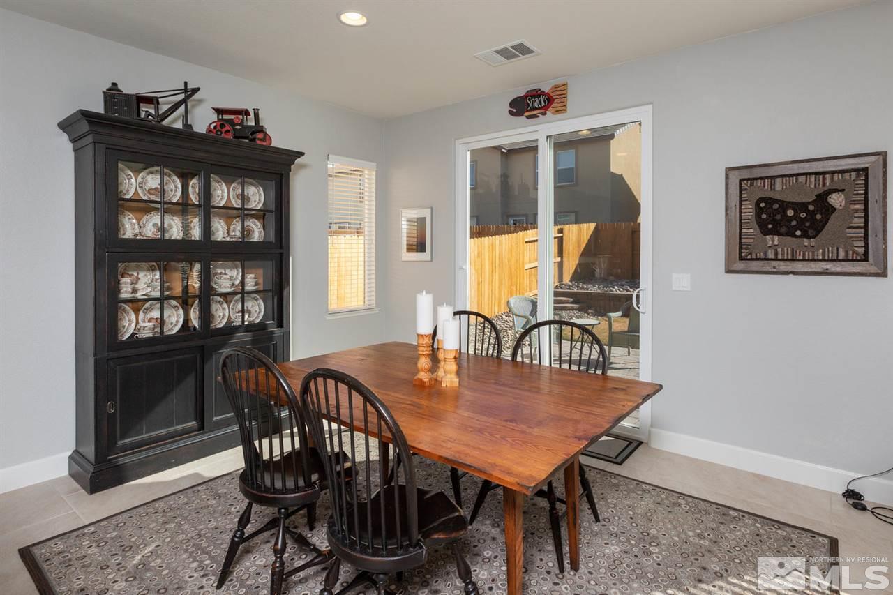1830 Cascade Stable Lane Reno, NV 89521 - Photo 9 of 25 a view of a dining room with furniture and a potted plant