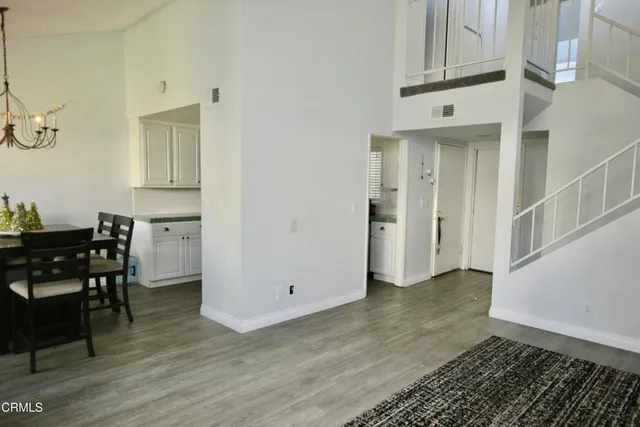 a view of kitchen with furniture and wooden floor