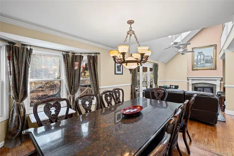 a living room with furniture fireplace and a window