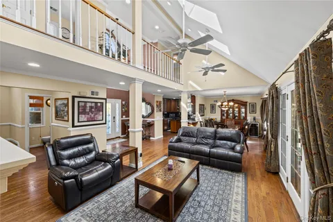 a spacious bedroom with a bed and dresser