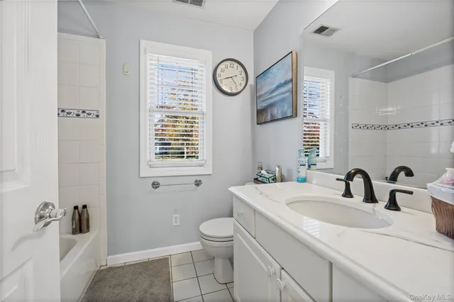 a backyard of a building with large trees