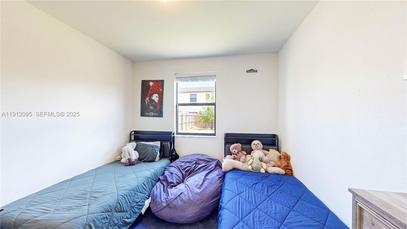 11964 Southwest 244th Street Homestead, FL 33032 - Photo 16 of 62 a bedroom with a bed and window