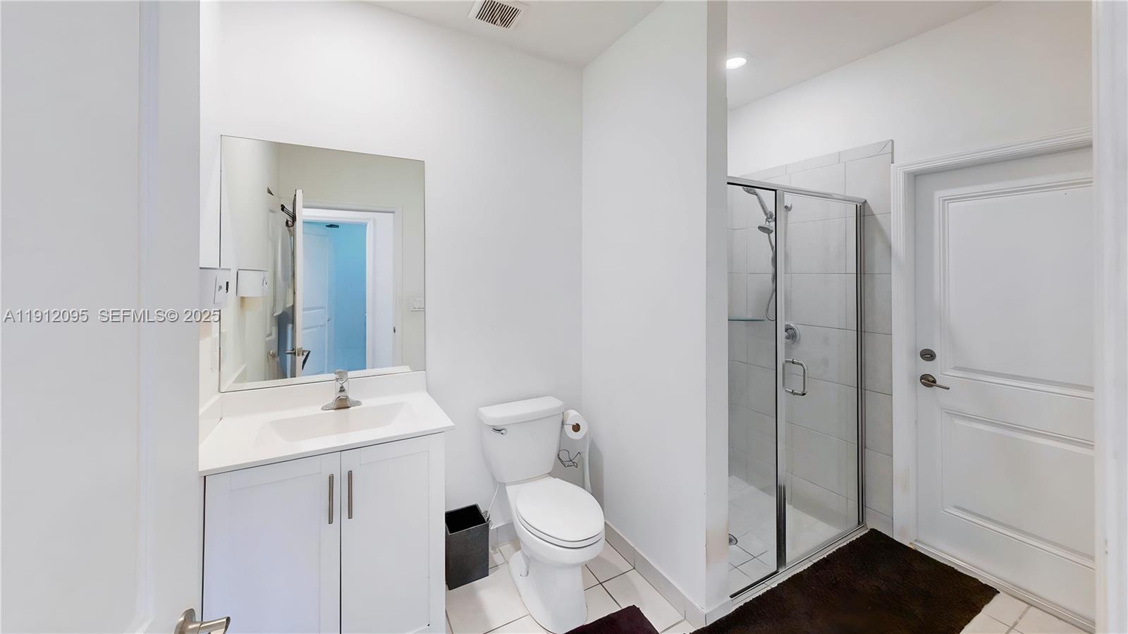 11964 Southwest 244th Street Homestead, FL 33032 - Photo 18 of 62 a bathroom with a sink a toilet and shower