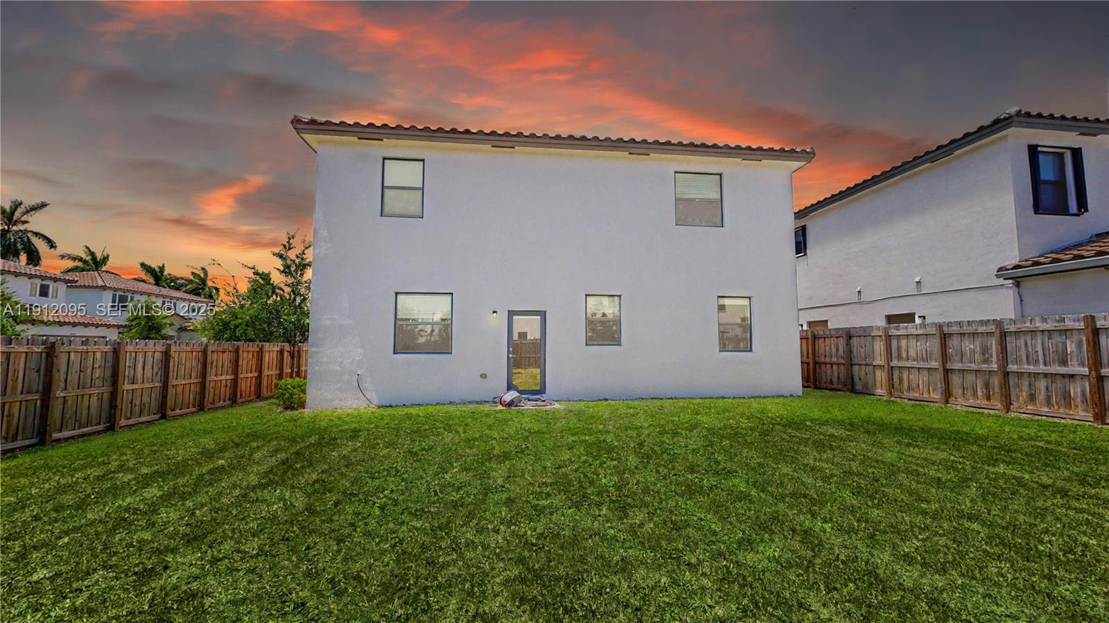 11964 Southwest 244th Street Homestead, FL 33032 - Photo 2 of 62 a view of a house with a yard and sitting area